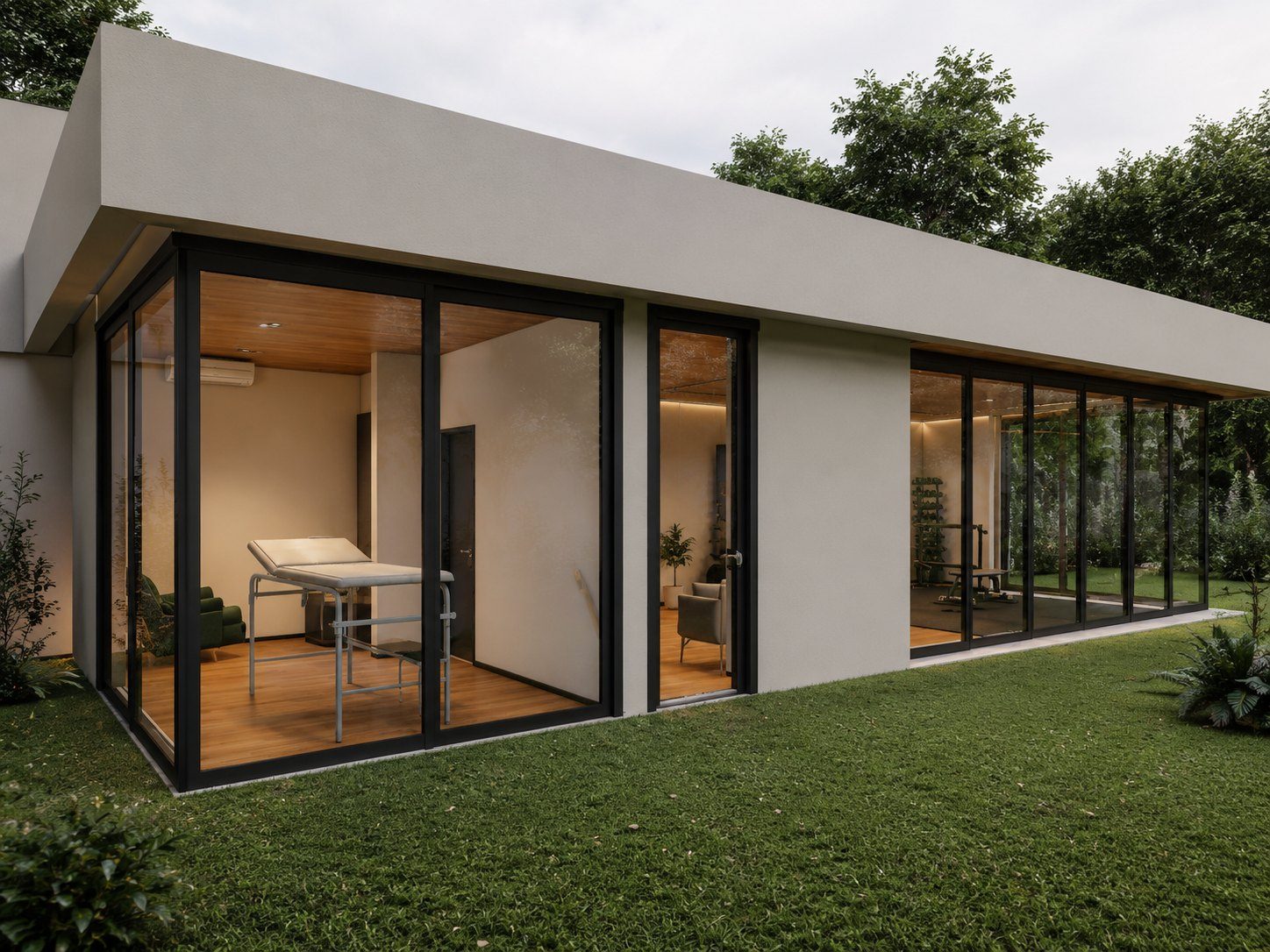 Pavilhão no jardim com a sala de massagem envidraçada em primeiro plano e a academia ao fundo